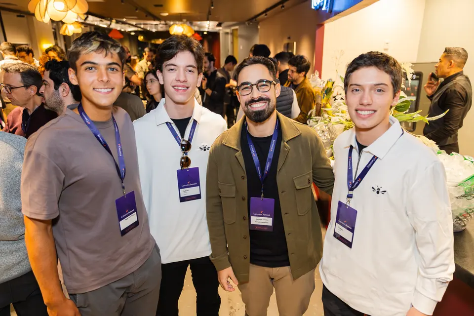 Four participants posing together at the evening gathering