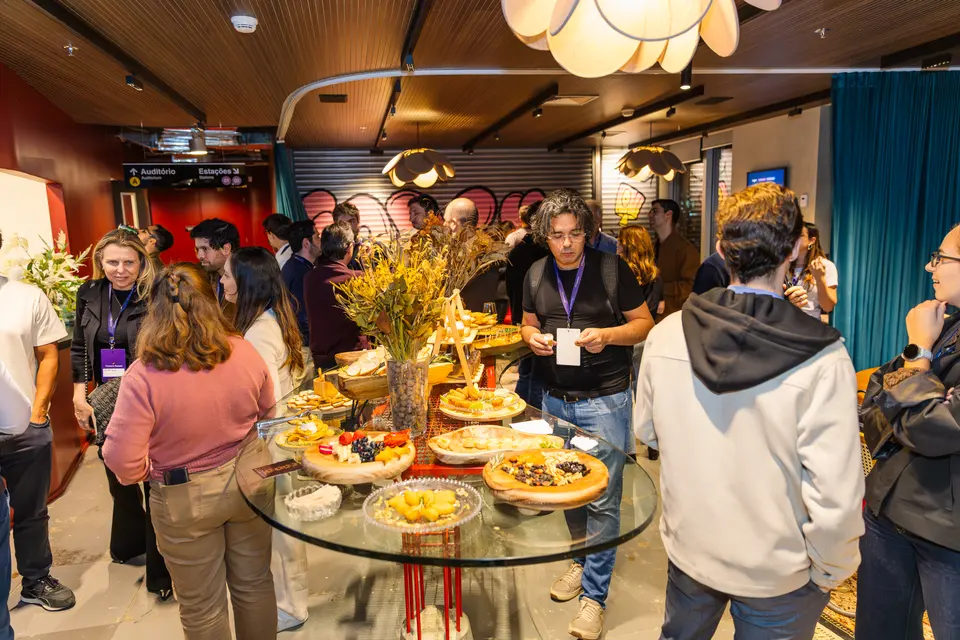 Participants around a buffet table at the evening gathering