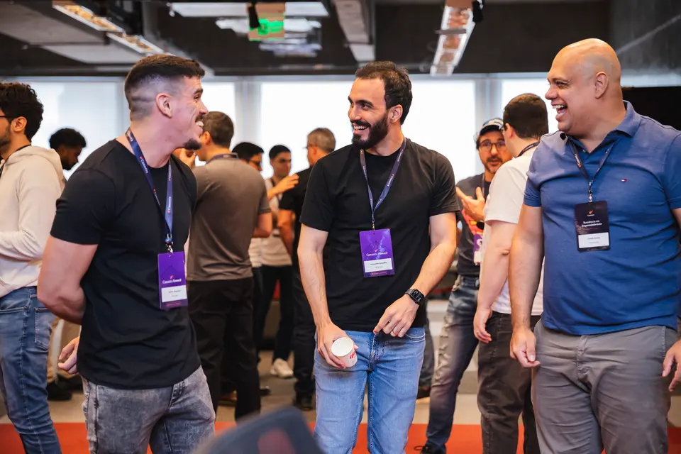 Participants laughing and talking in a circle